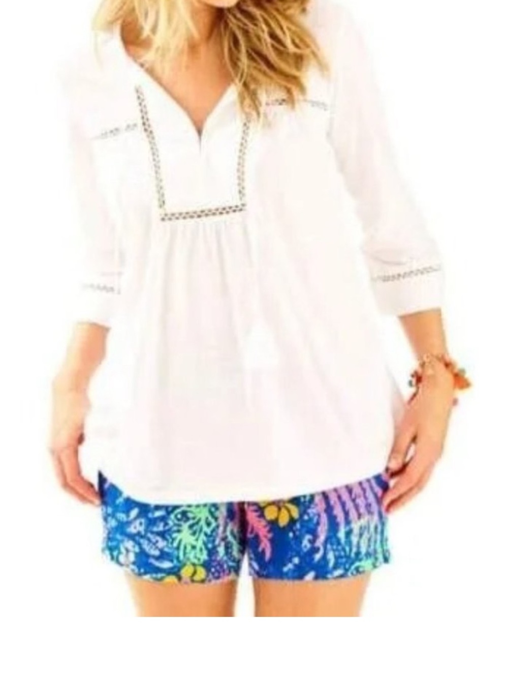 Lilly Pulitzer white cotton tunic top  a ladder lace trim and tassel ties.